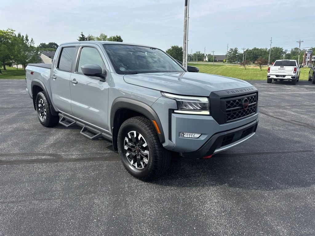 2024 Nissan Frontier PRO-4X in Boulder Gray Pearl — front three-quarter view