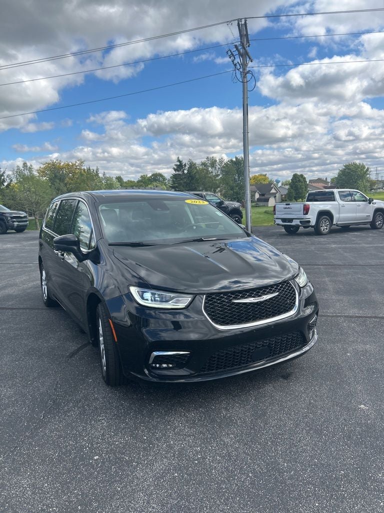 2023 Chrysler Pacifica Touring L in Brilliant Black Crystal Pearlcoat — front three-quarter view